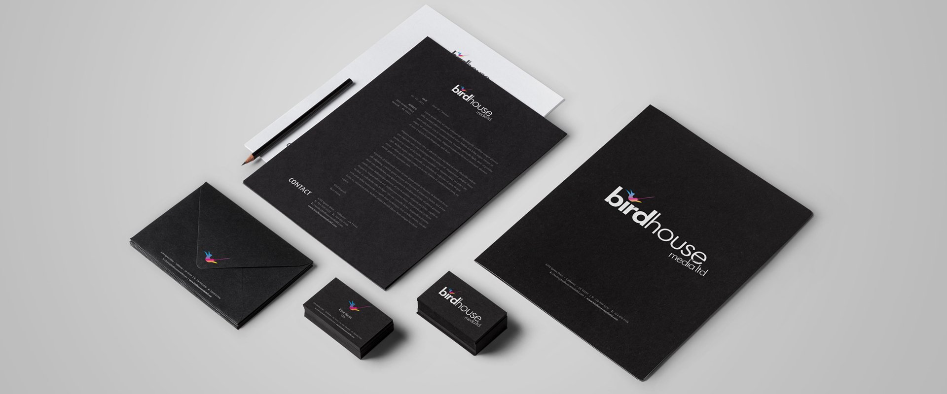 Full stationery set for a media company branding project. Using black paper for the letterhead, envelope and business cards.